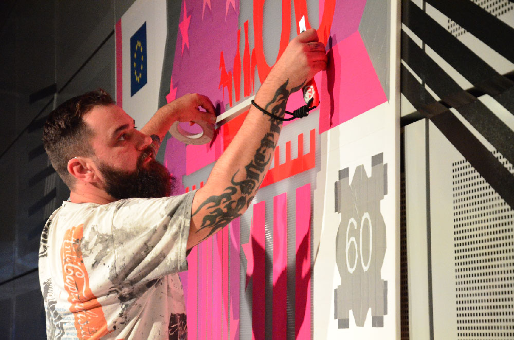 Künstler bei der Live-Umsetzung an der Wand